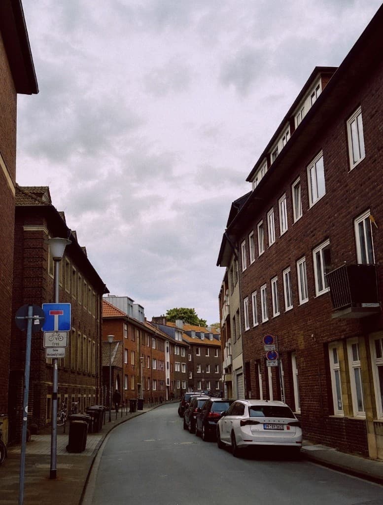 European brick neighborhood street with residential buildings
